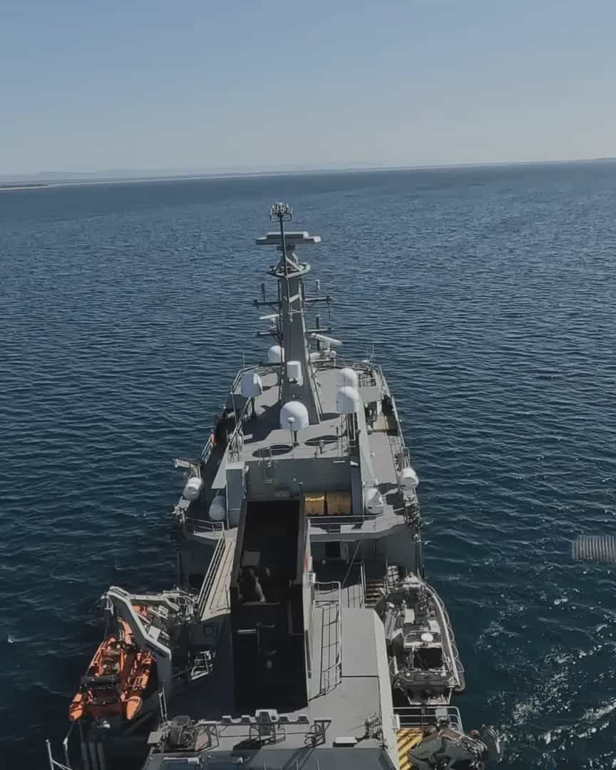 Flying in over open ocean towards a naval vessel, then machining and assembly on the Freespace production floor, then a Callisto flying ahead of a vehicle on an outback road